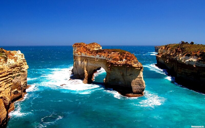 Natural Rock Arch Formation — Blue, Serene, Afternoon, Photograph, Ocean, Cliffs, Sky