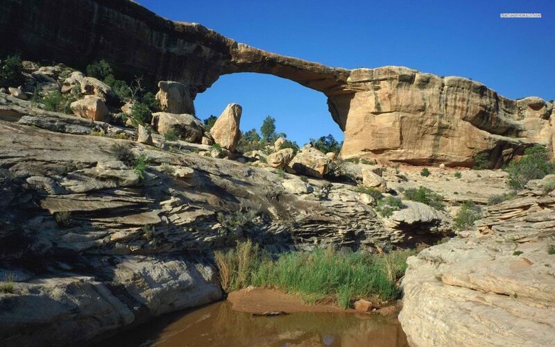 Natural Rock Arch Formation — Blue, Serene, Afternoon, Photograph, River