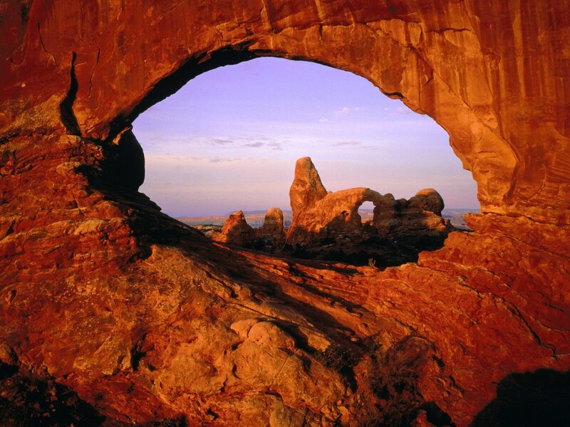 Natural rock arch framing a scenic view