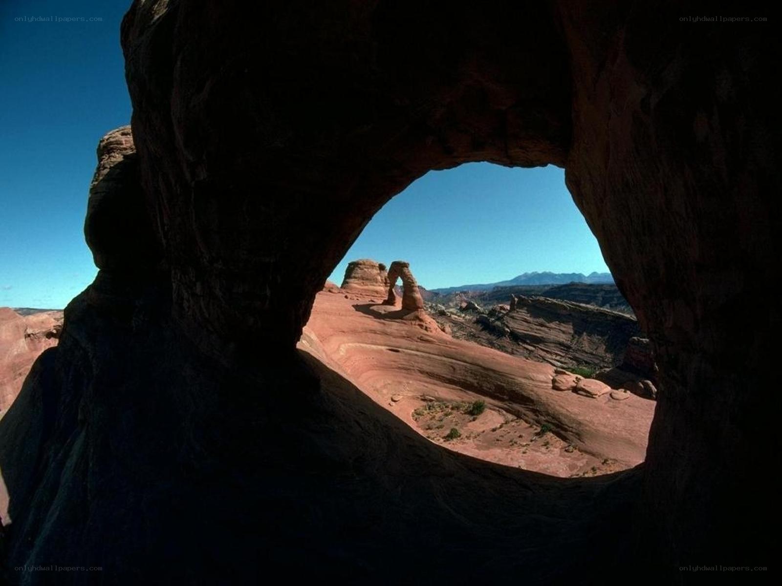 Natural rock arch framing another arch