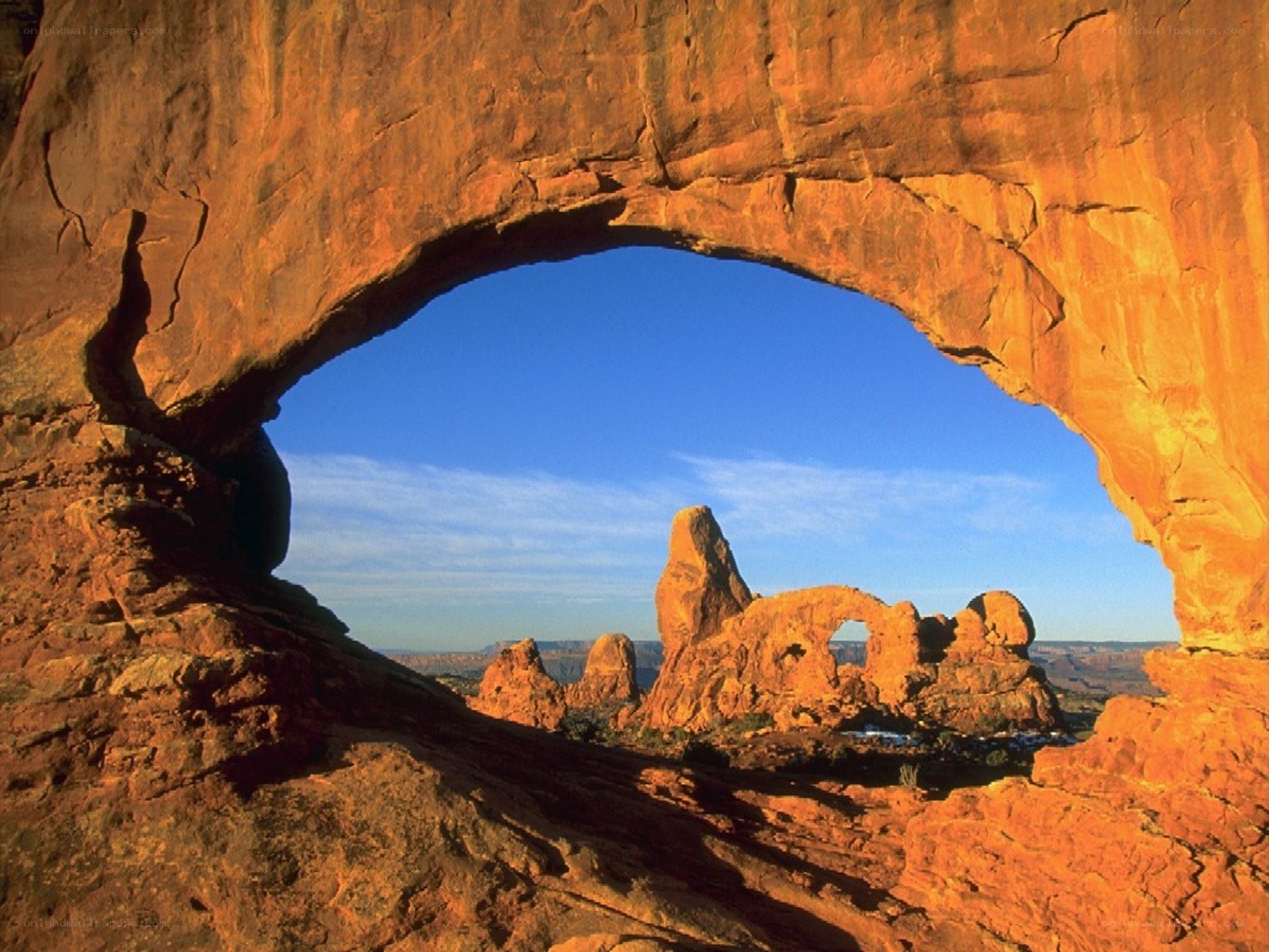 Natural rock arch framing landscape