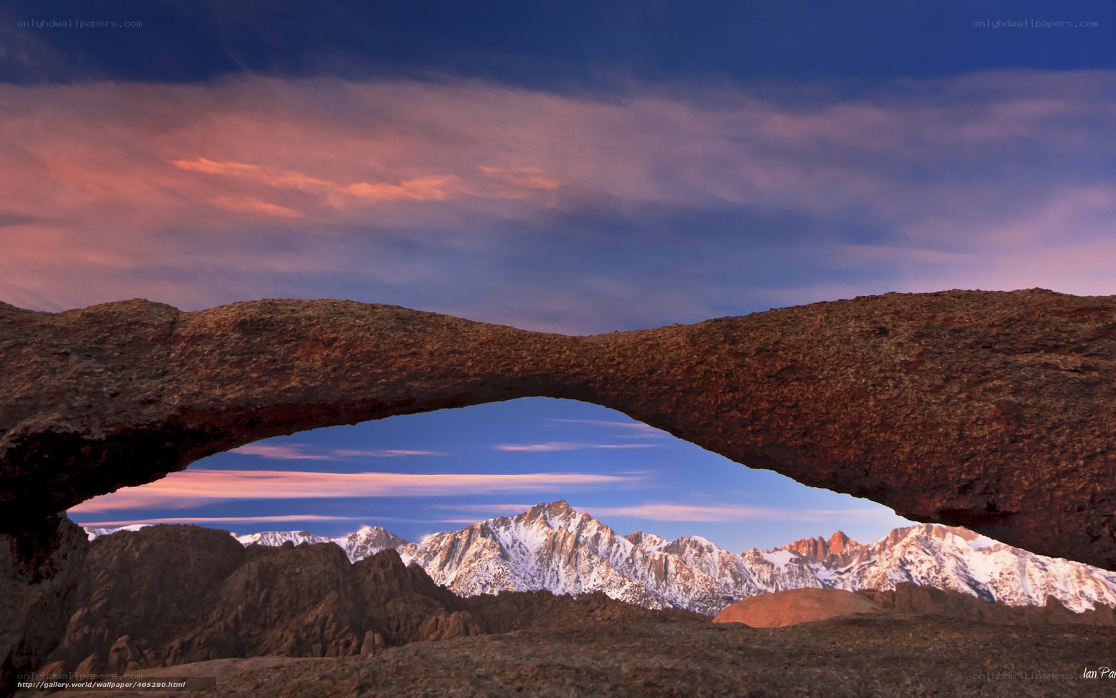 Natural rock arch framing mountains