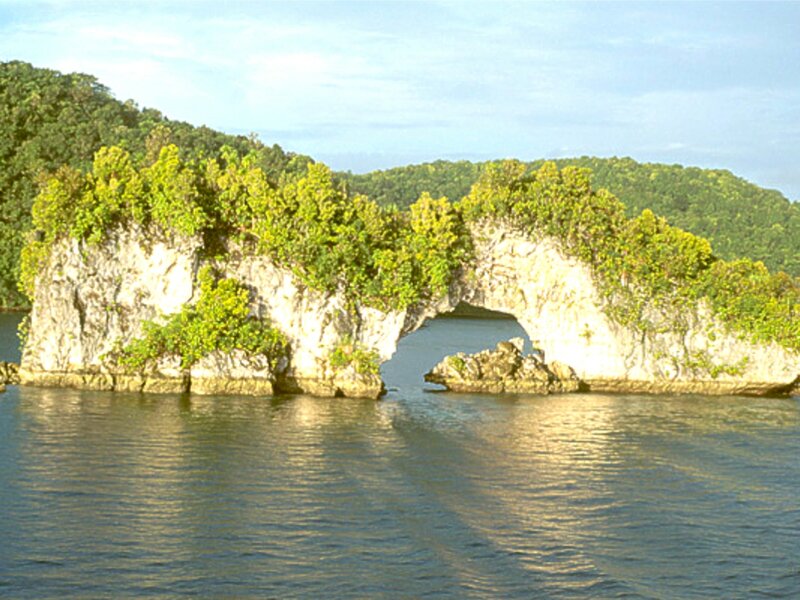 Natural rock arch in a tropical bay