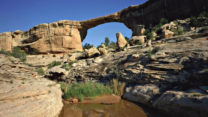 Natural rock arch in desert canyon