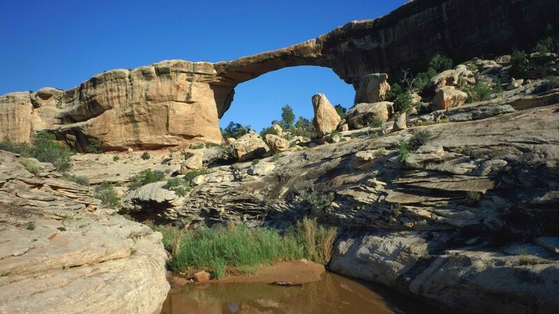 Natural rock arch in desert canyon
