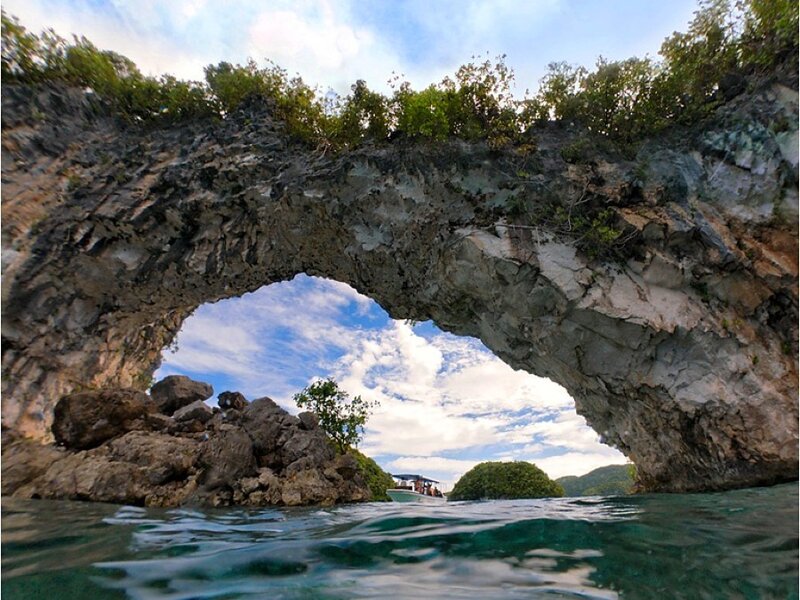 Natural rock arch in tropical waters