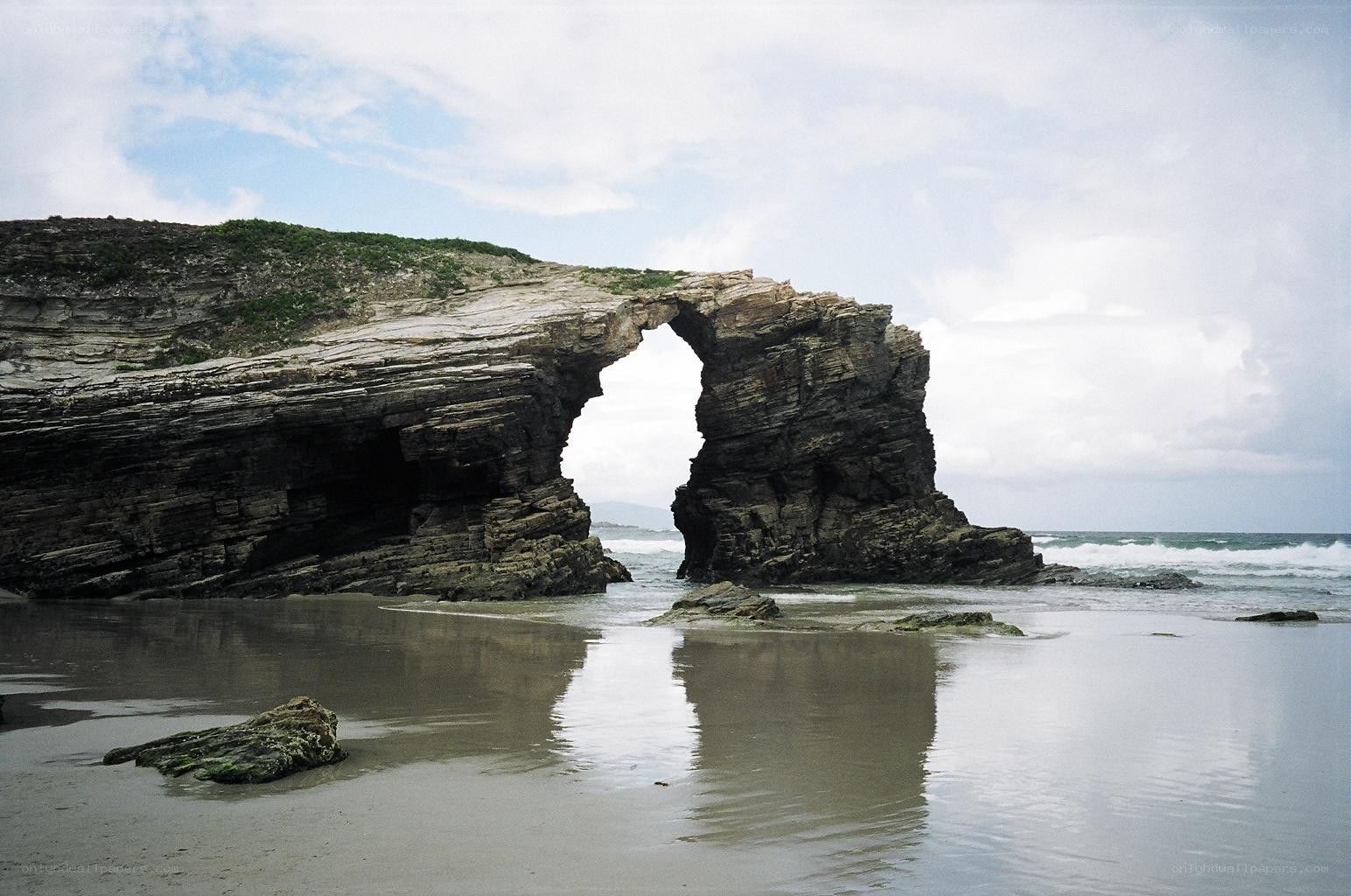Natural rock arch on a beach