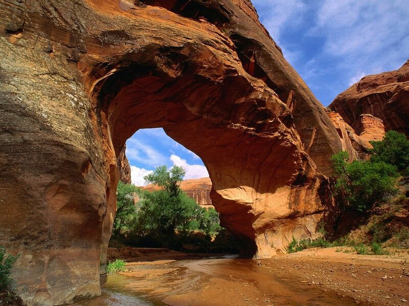 Natural rock arch over river
