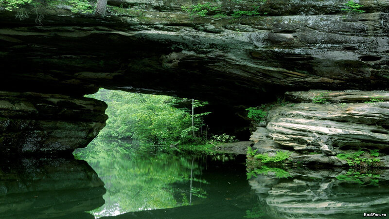 Natural Rock Arch over River — Green