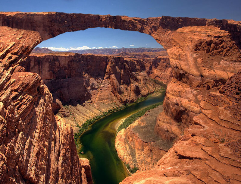 Natural Rock Arch over River — Red