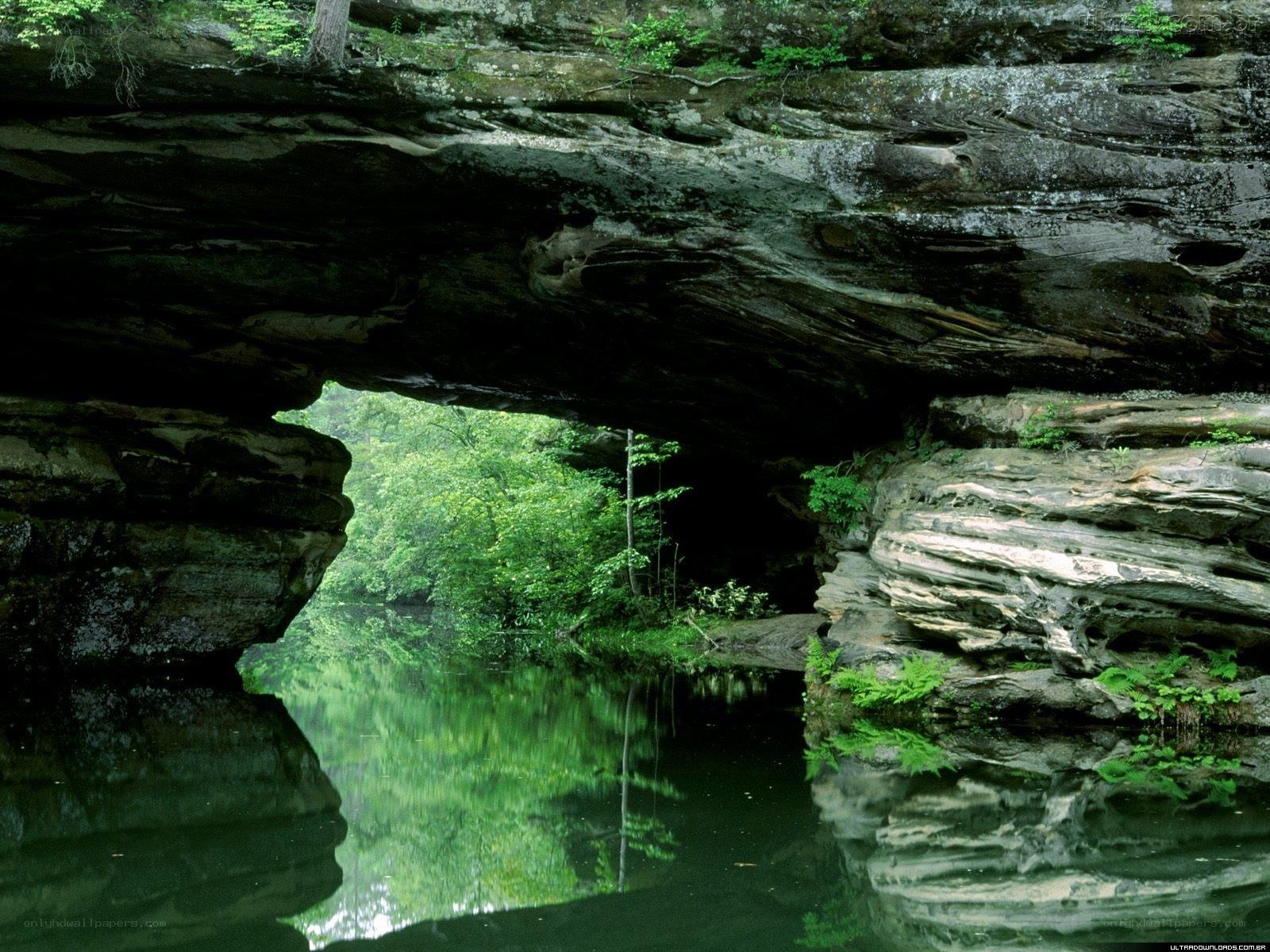 Natural rock arch over river