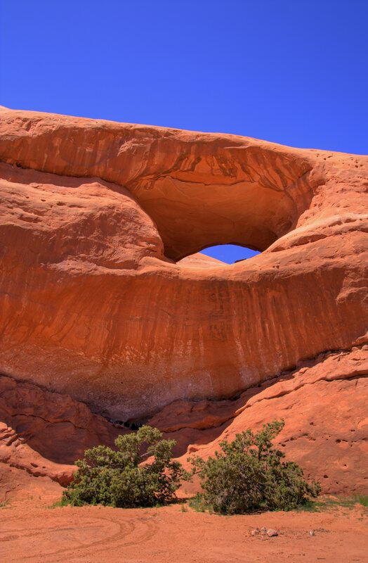 Natural rock arch with blue sky