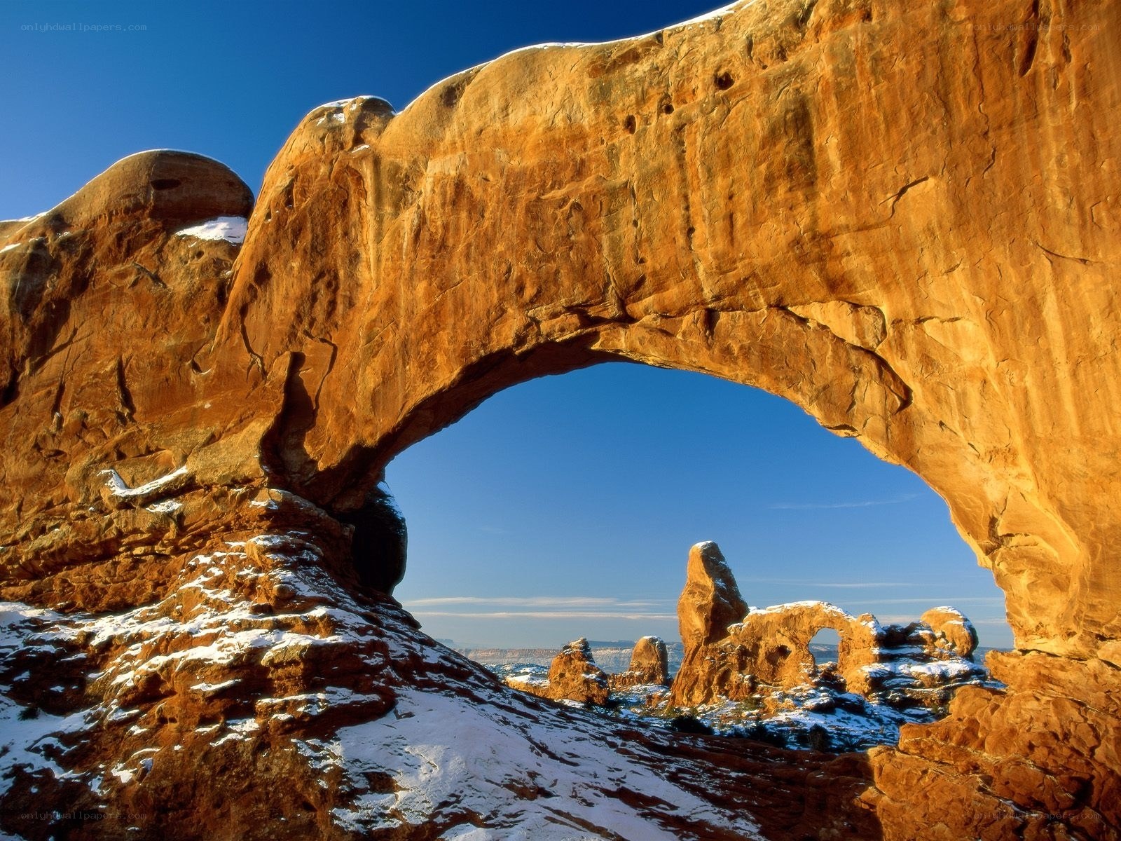 Natural rock arch with snow