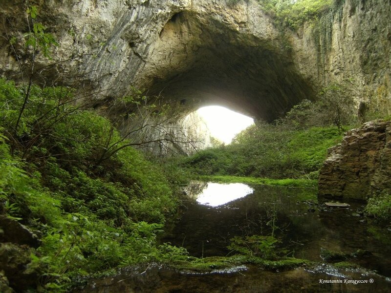 Natural rock arch with stream