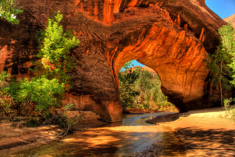 Natural Rock Arch with Stream — Red