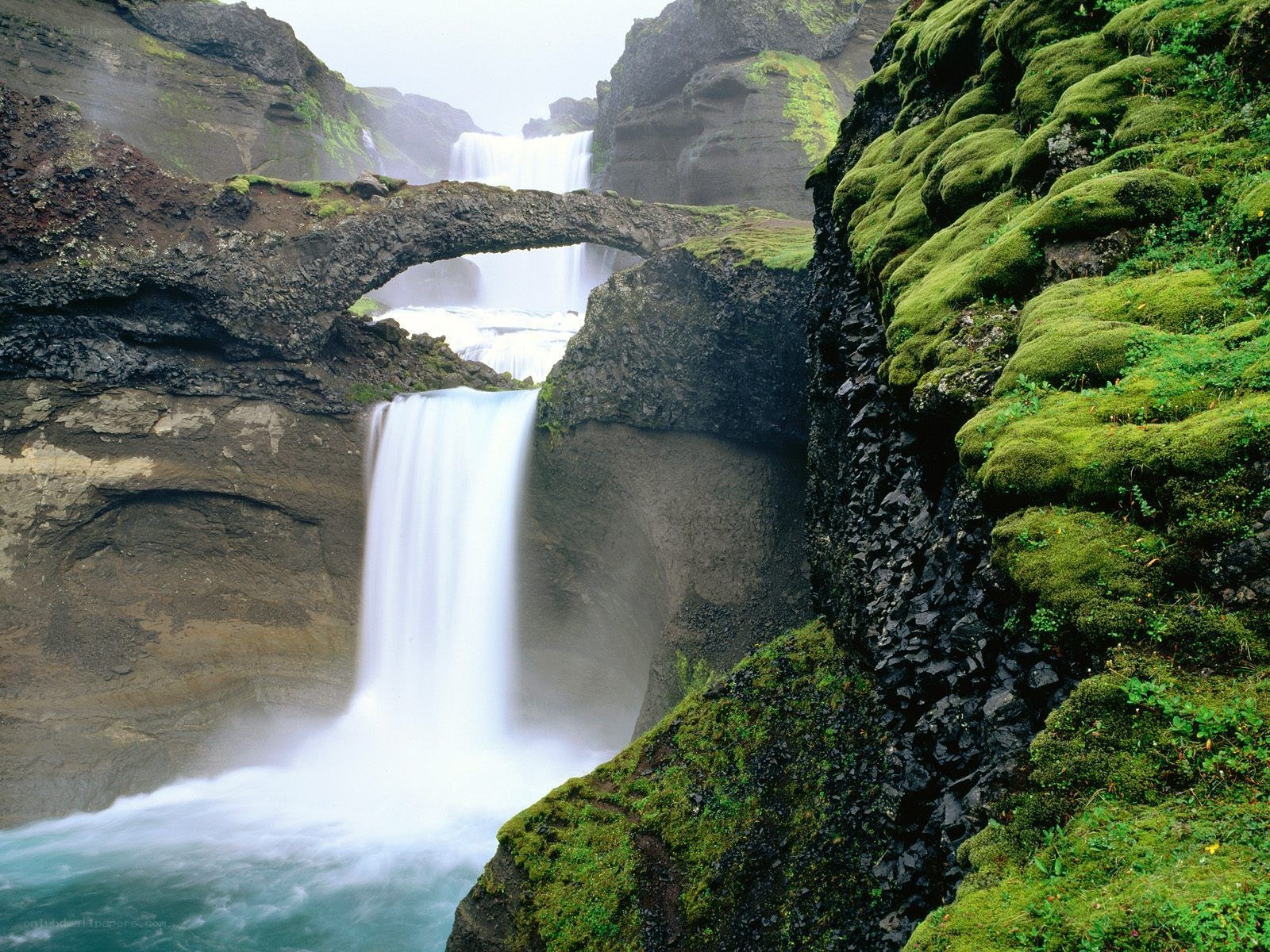 Natural rock bridge waterfall