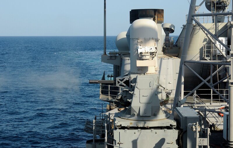 Naval ship firing weapon