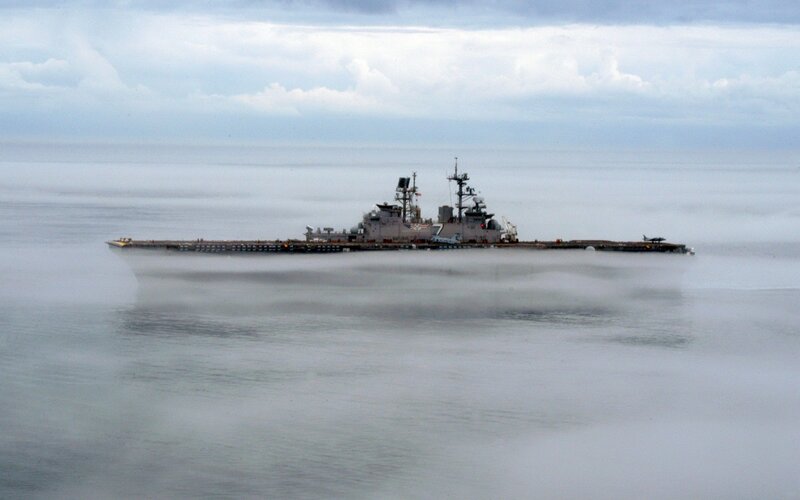 Naval ship in foggy sea