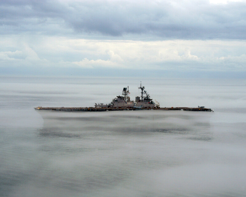 Naval ship in foggy sea