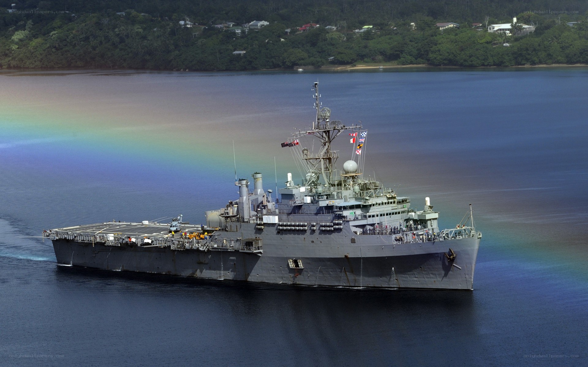 Naval ship with rainbow in background