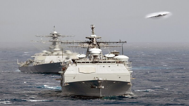 Naval ships at sea with aircraft
