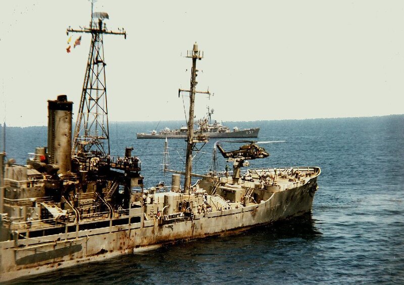 Naval ships at sea with helicopter