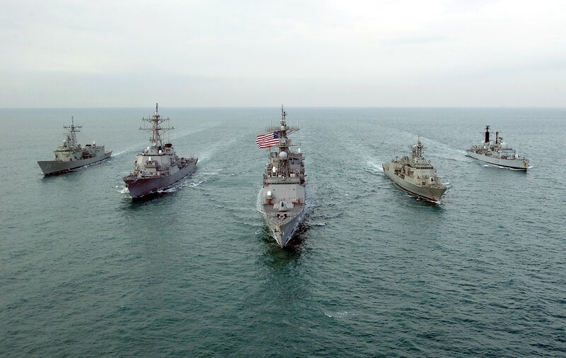 Naval ships in formation at sea