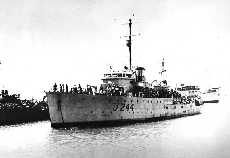Naval vessel J 244 at port