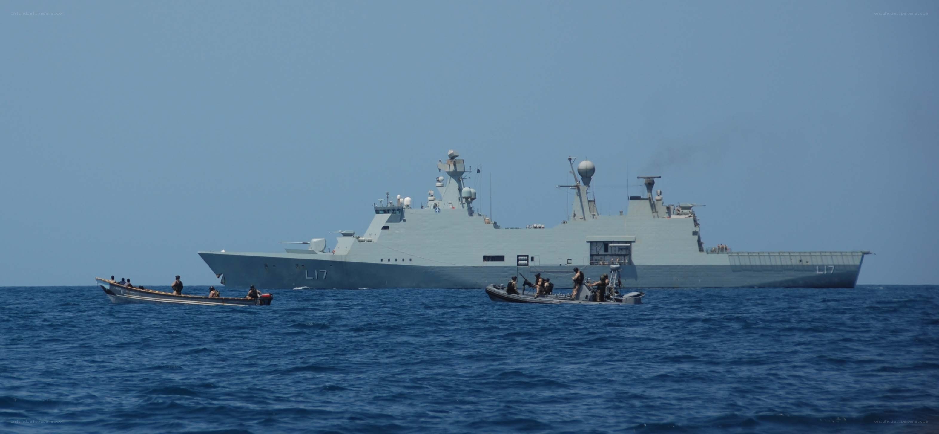 Naval vessel with small boats