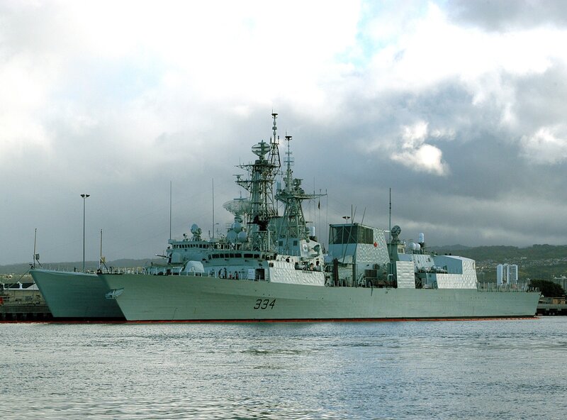 Naval Warship in Harbor — Gray, Overcast