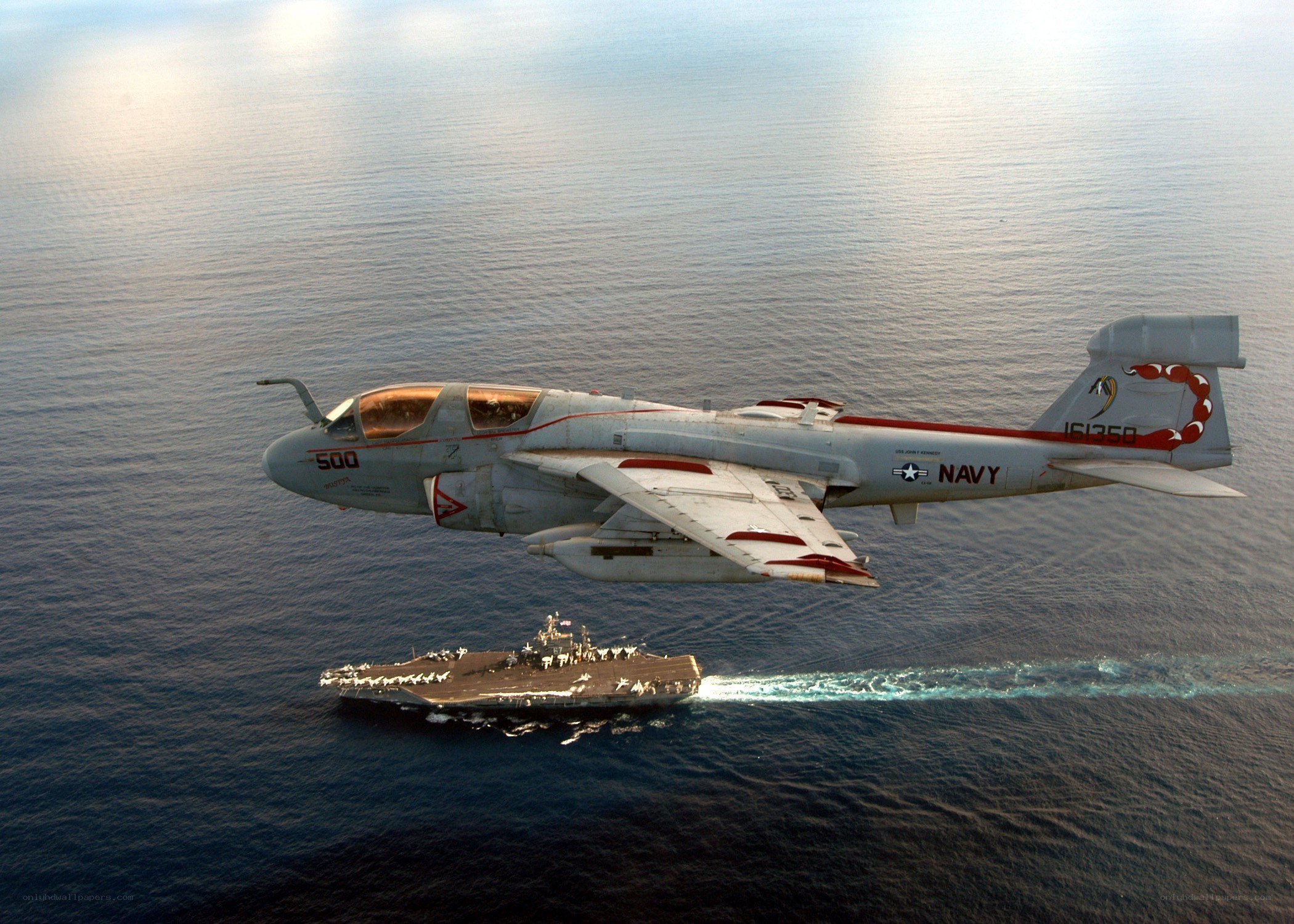Navy aircraft over carrier