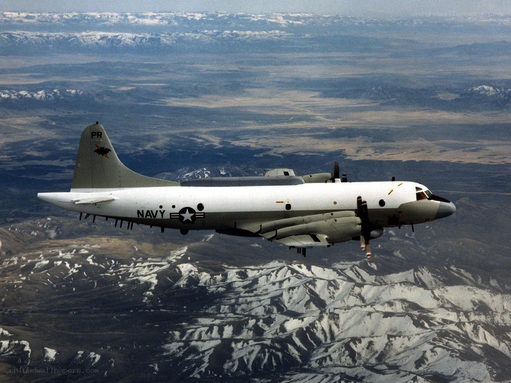 Navy aircraft over mountains