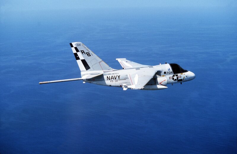 Navy aircraft over ocean