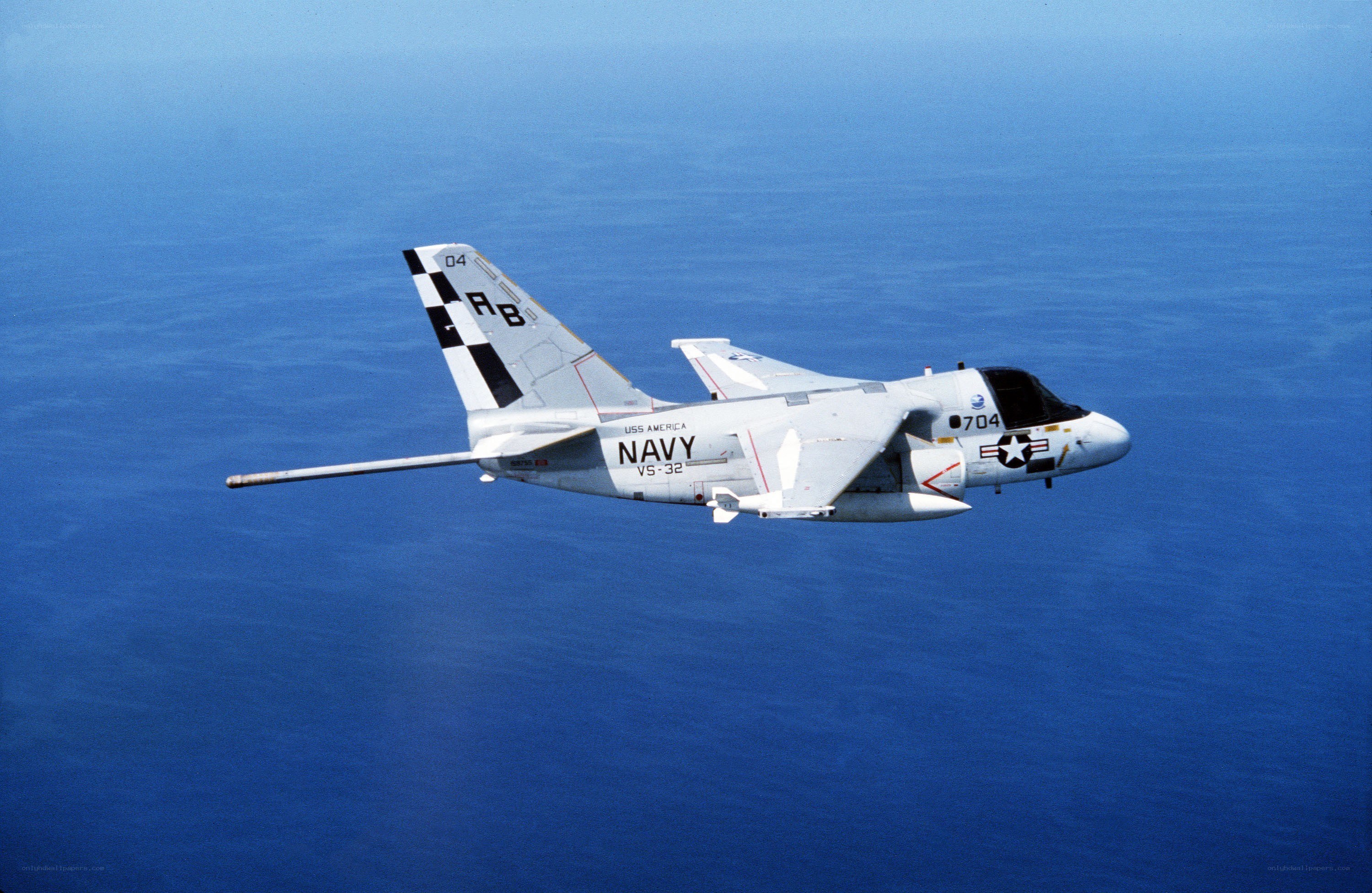 Navy aircraft over ocean