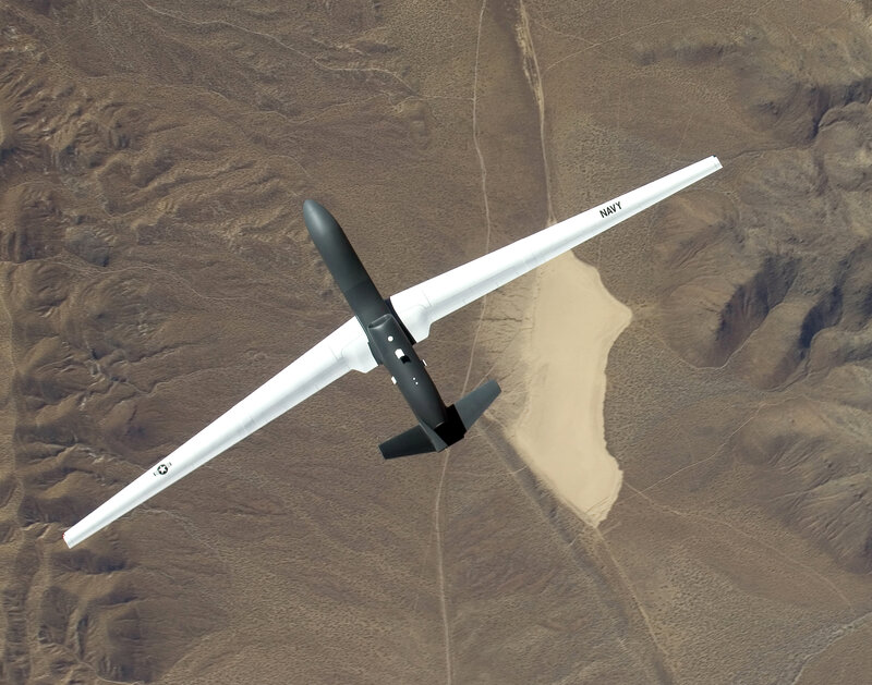 Navy drone flying over desert