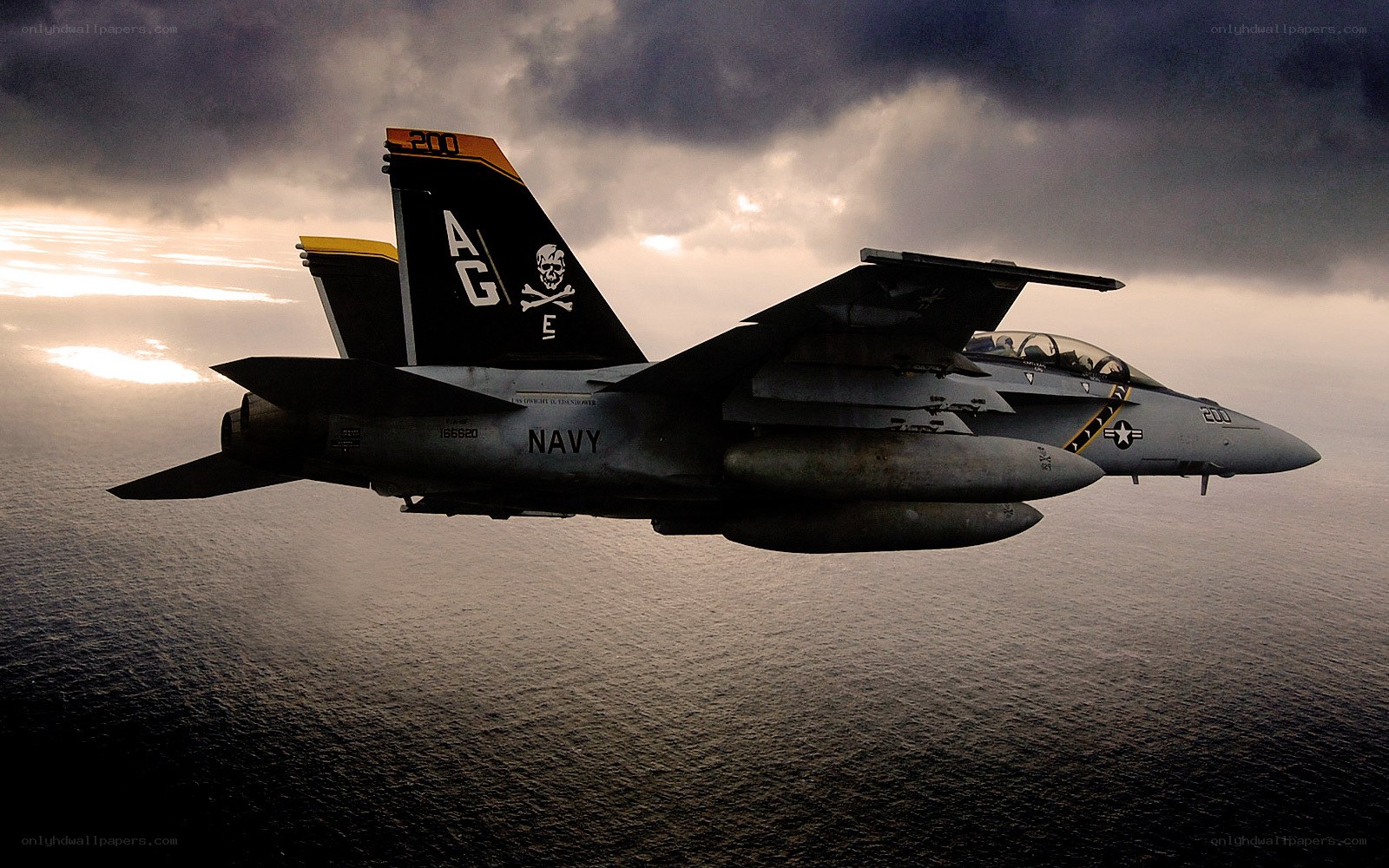 Navy fighter jet over ocean