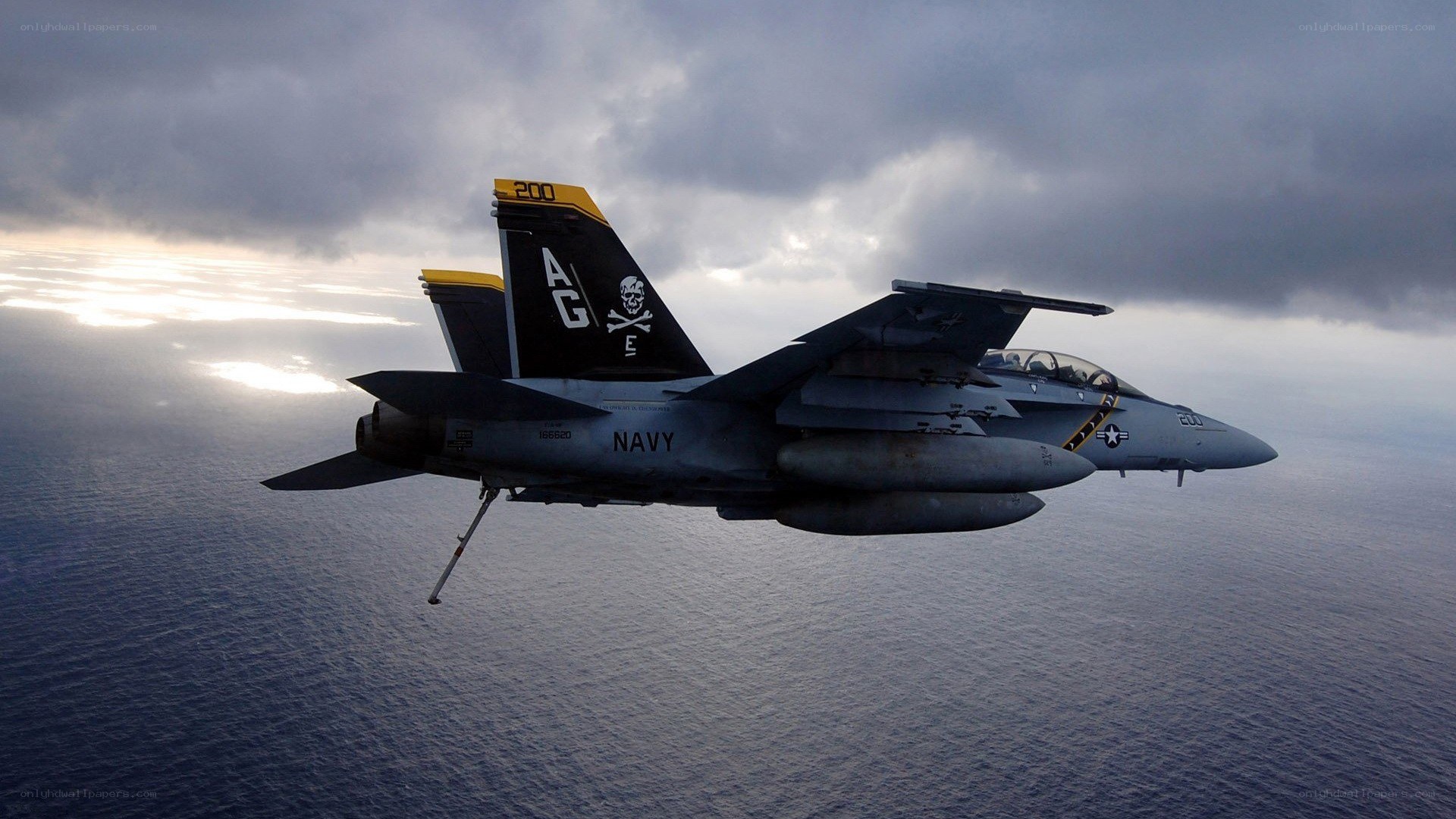 Navy fighter jet over ocean