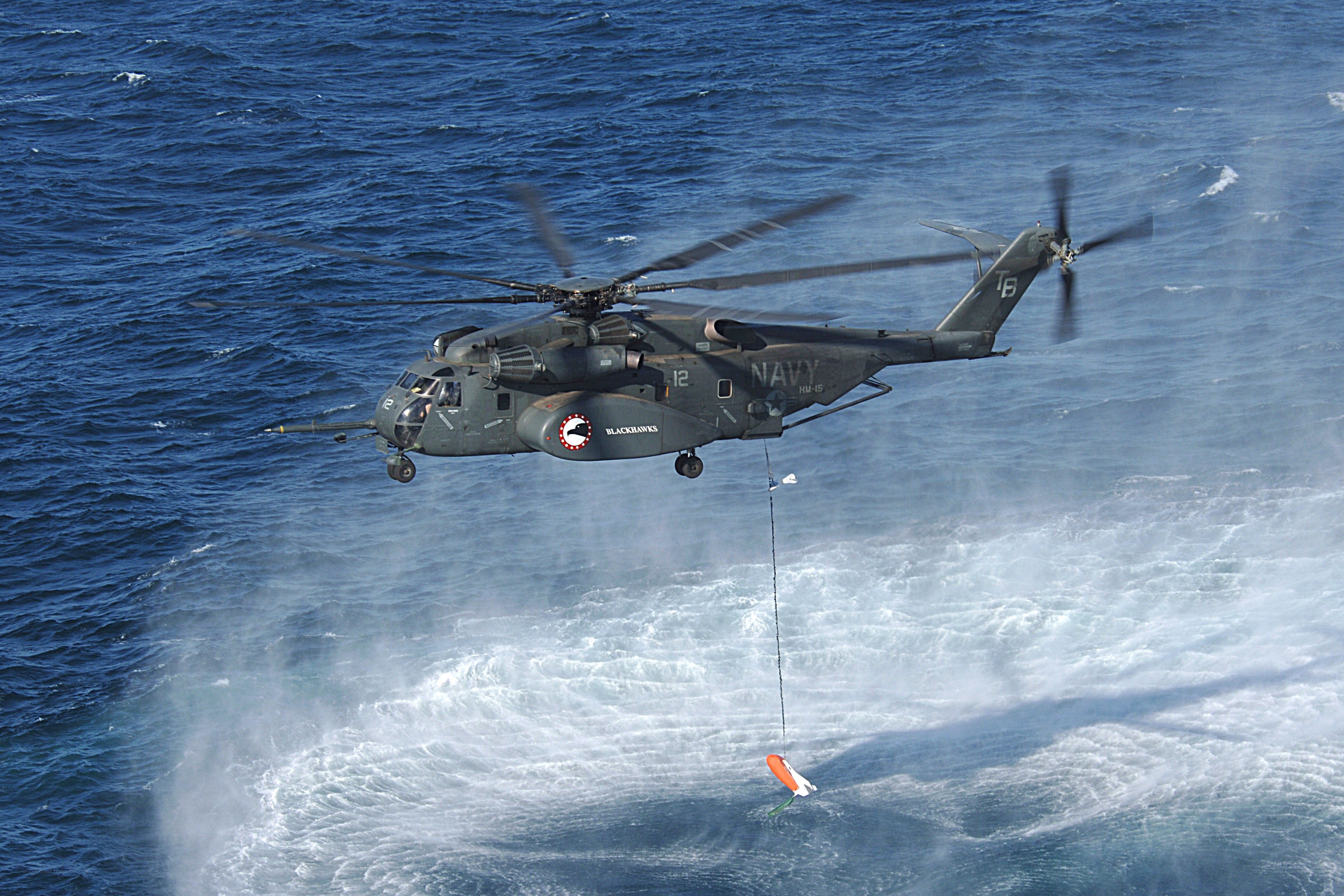 Navy helicopter over ocean