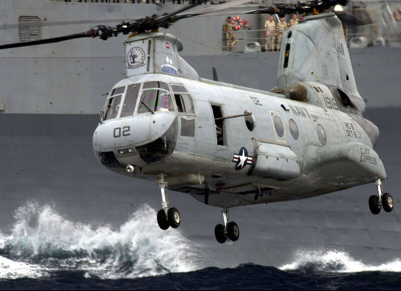 Navy helicopter over ocean