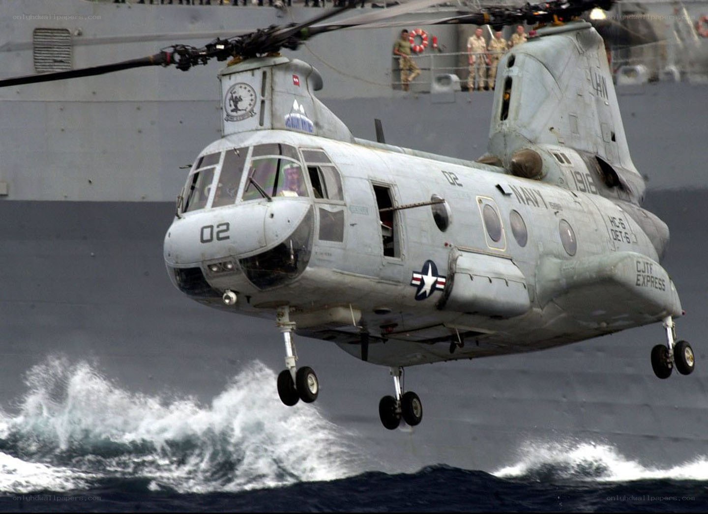 Navy helicopter over ocean