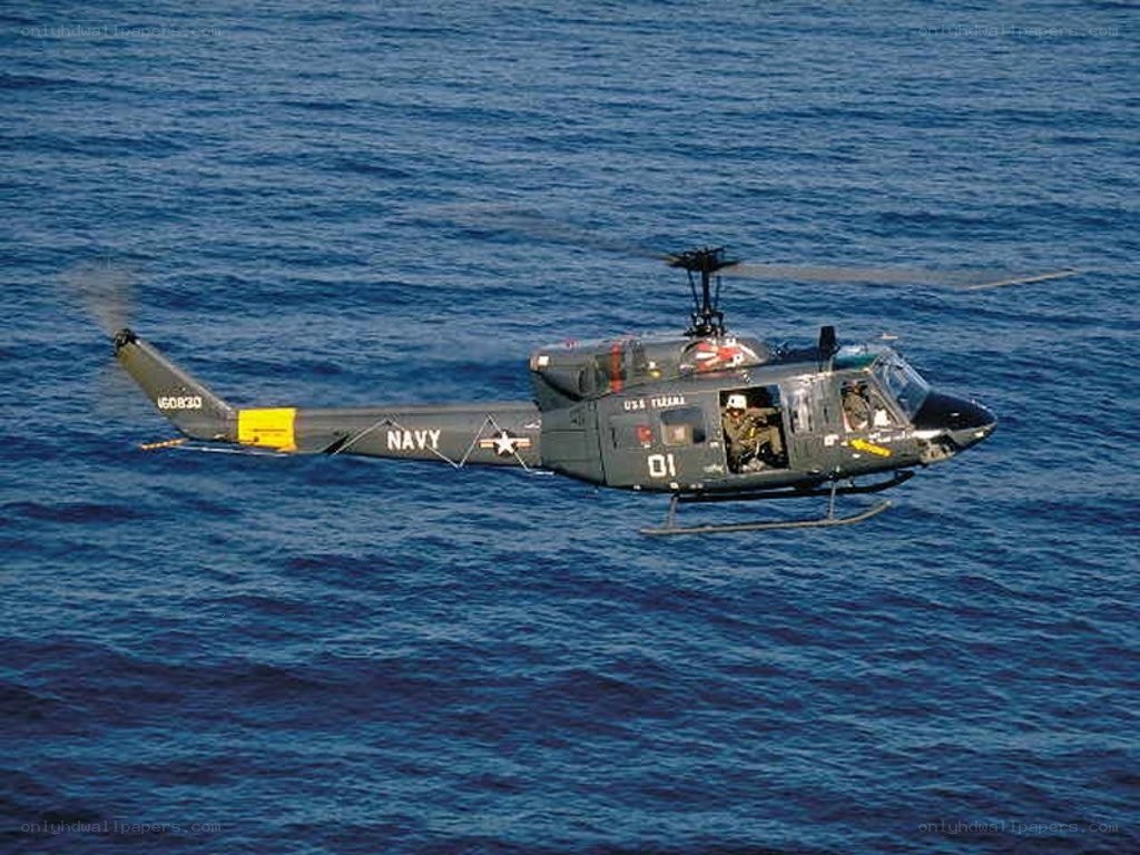 Navy helicopter over ocean