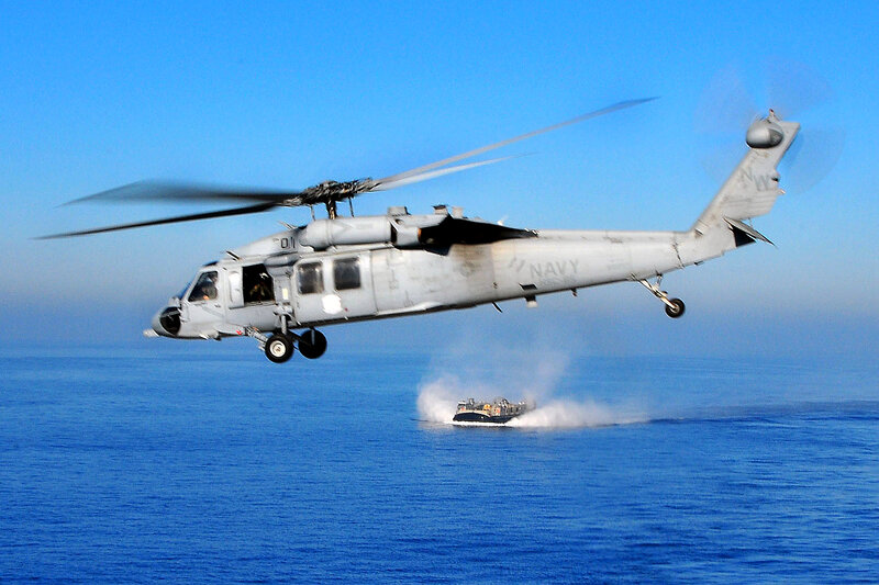 Navy helicopter over ocean