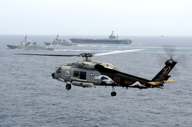 Navy Helicopter over Ocean — Gray, Dramatic