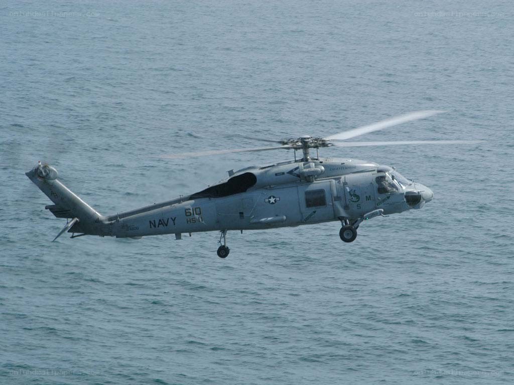 Navy helicopter over water