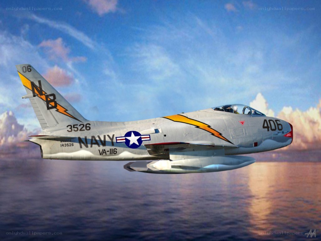 Navy jet flying over water