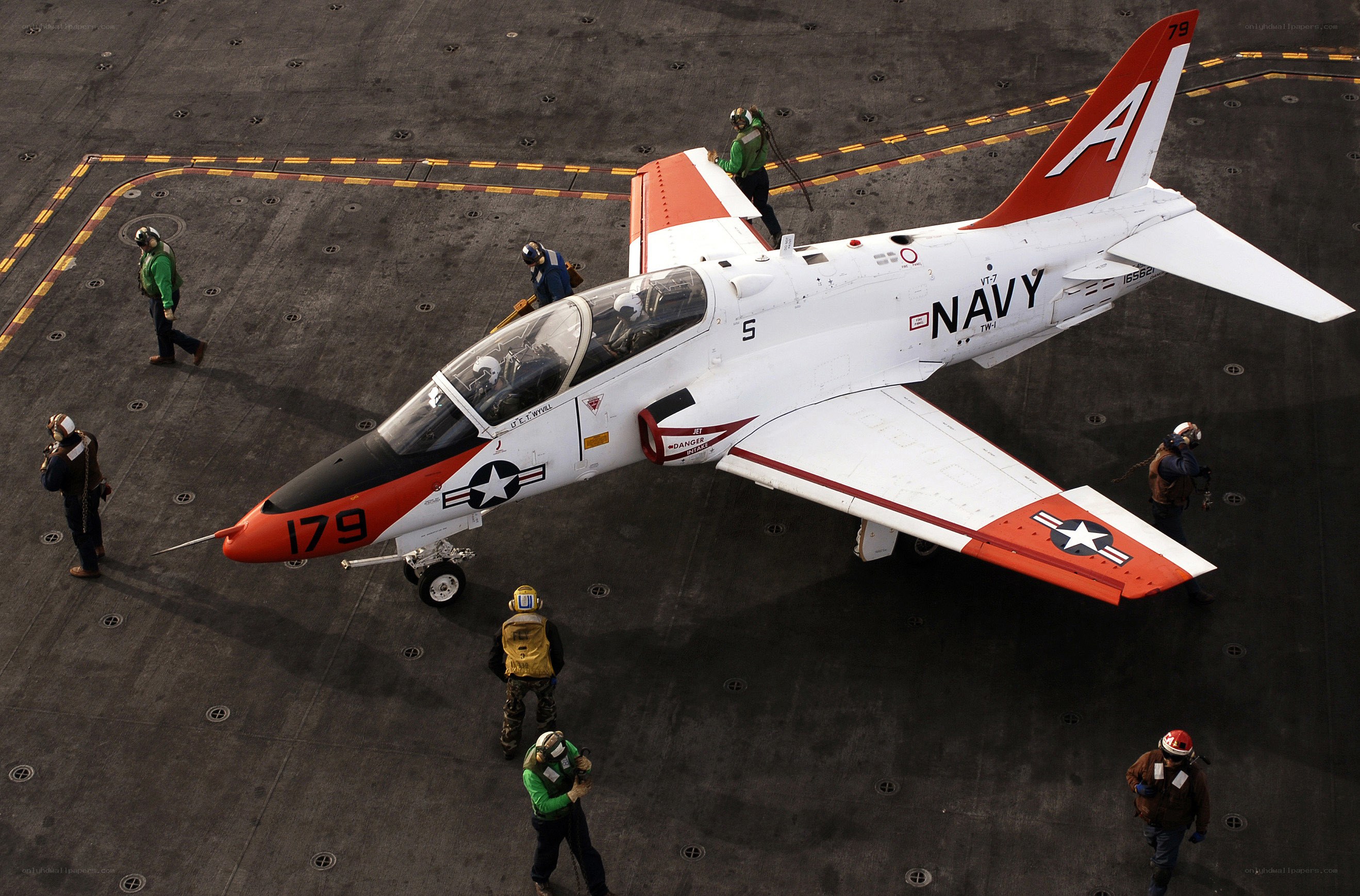 Navy jet on aircraft carrier deck