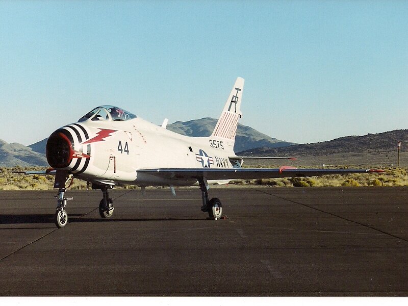 Navy Jet on Tarmac — White