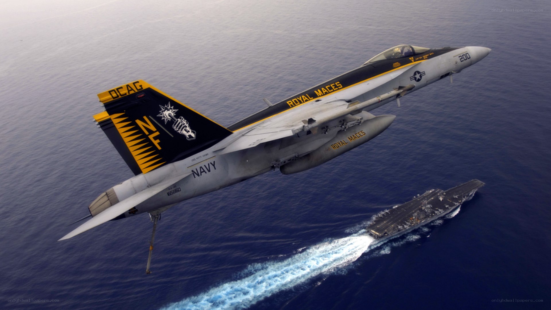 Navy jet over aircraft carrier