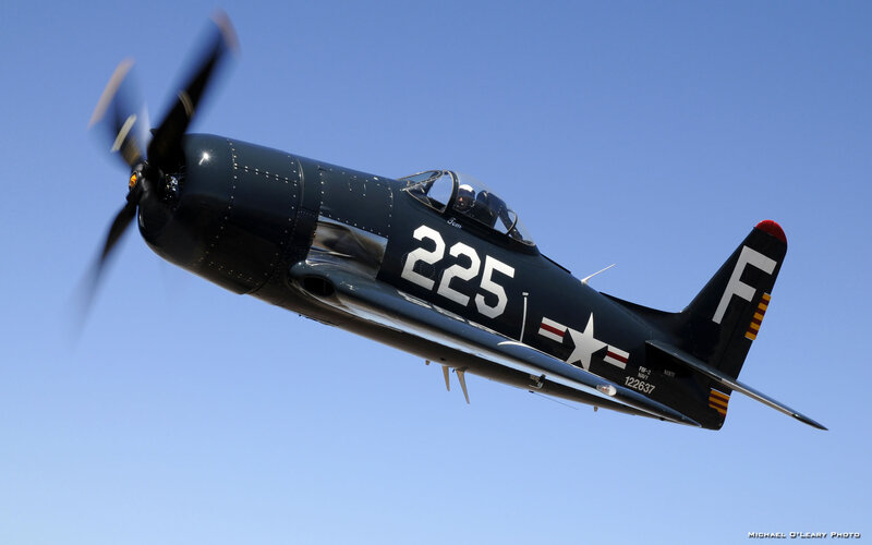 Navy Propeller Plane — Blue, Dynamic, Afternoon, Photograph, Pilot