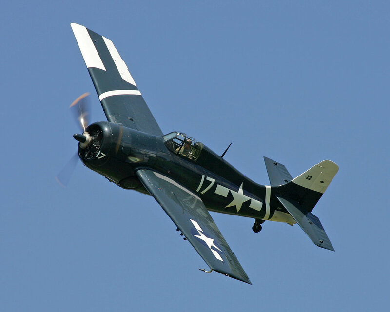 Navy Propeller Plane — Blue, Dynamic, Afternoon